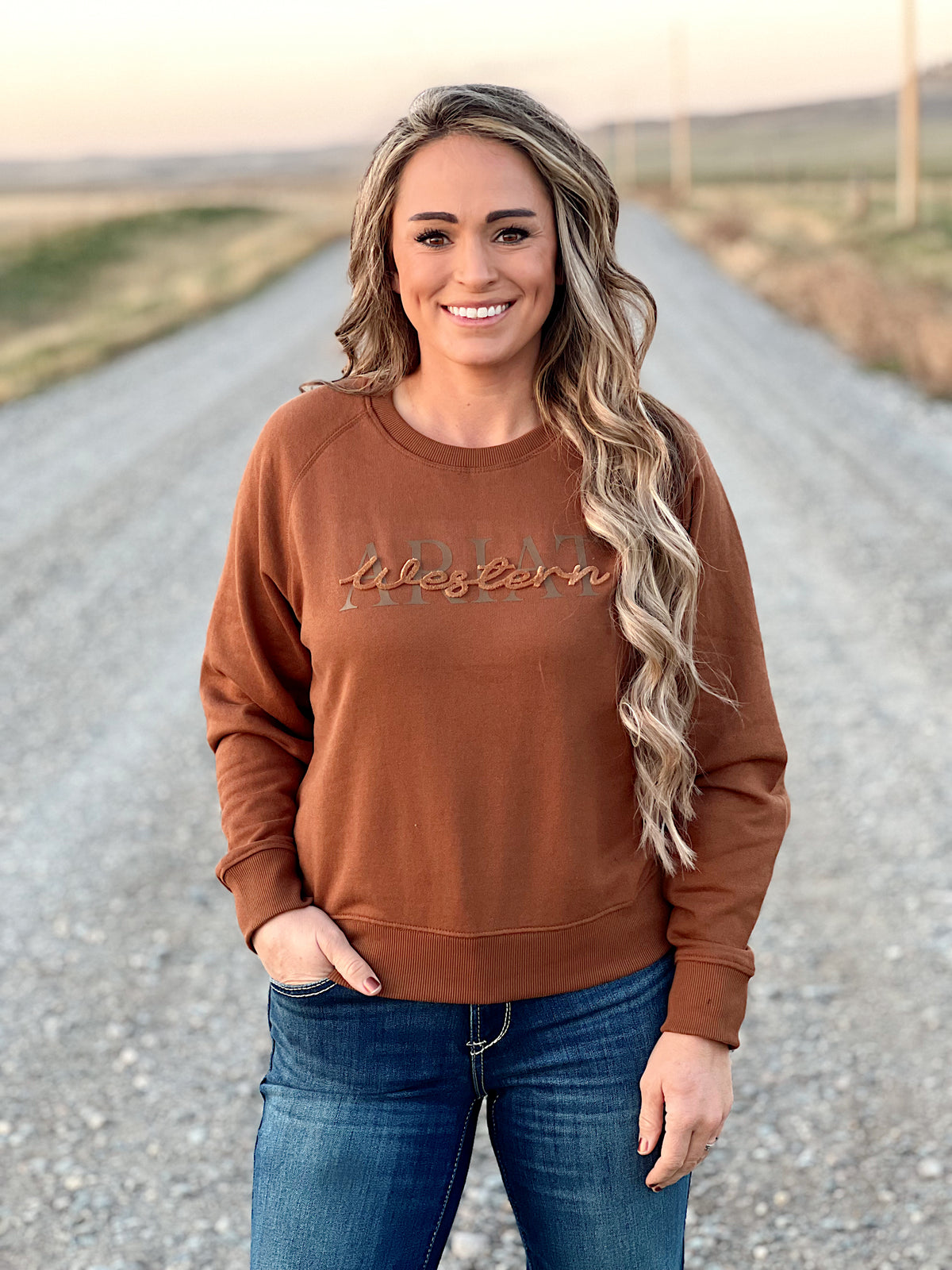 The Ariat Cowgirl Crew Neck Sweatshirt in Brown